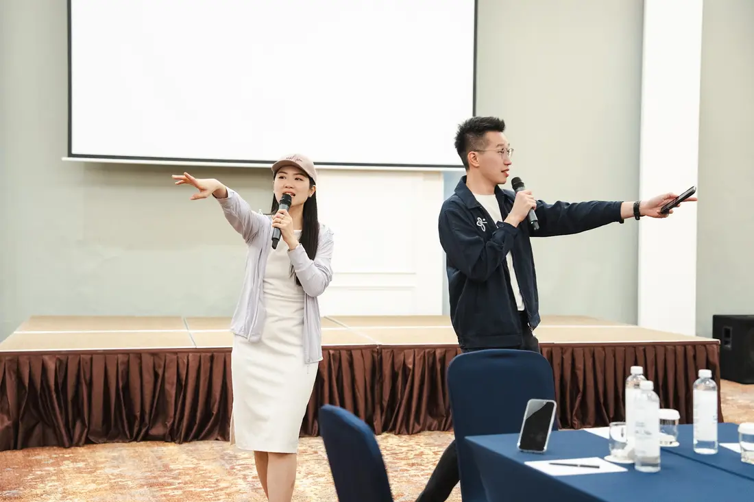 Members sharing on stage at a Blueprint Community retreat
